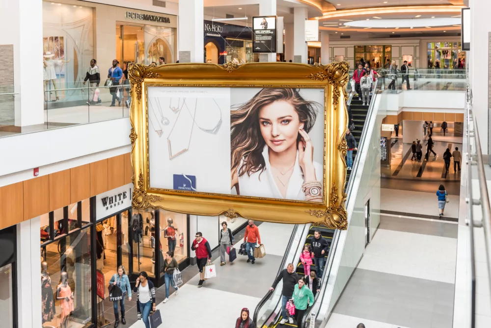 A Custom Banner and Hoist System With Holiday Frame Inside of a Mall