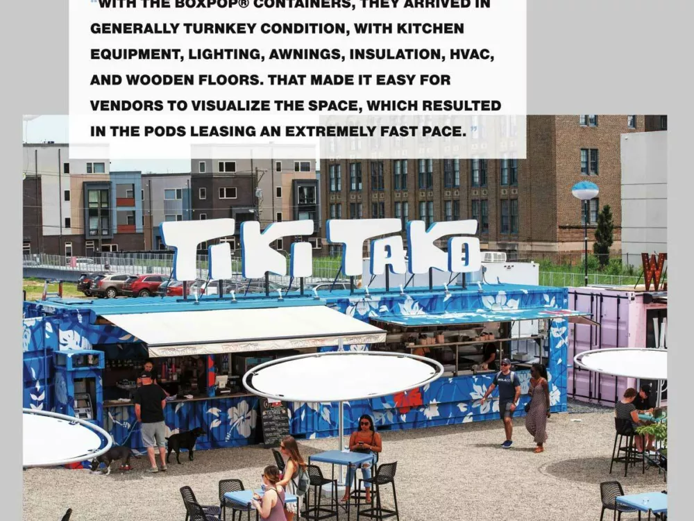 A row of custom shipping container bars within the pod park