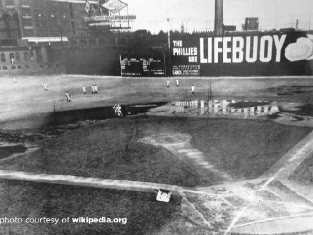 Huge billboard in a vintage photo of the Baker Bowl