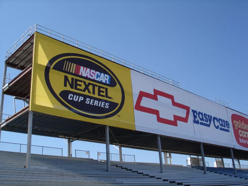 Mesh Printed Banner With Sponsors at a NASCAR Event